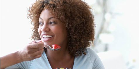  photo black-woman-eating-fruit.jpg