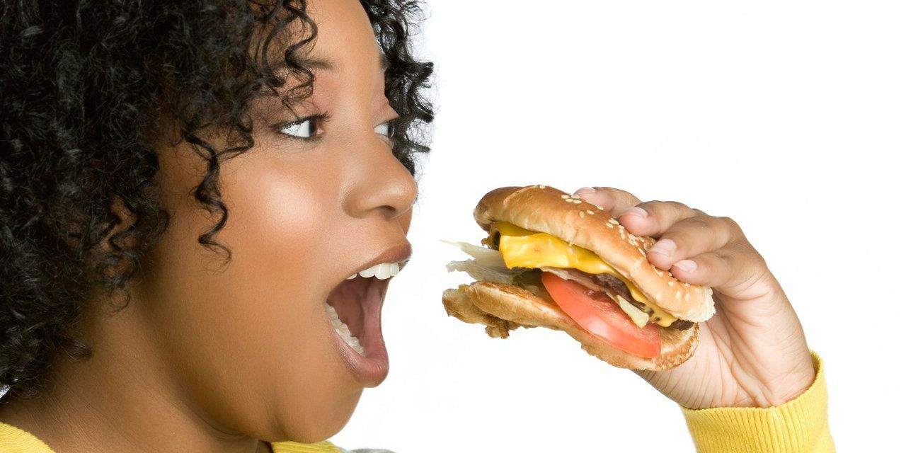 black woman eating unhealthy